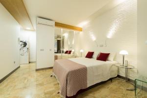 Posteľ alebo postele v izbe v ubytovaní Suites Garden Loft Kandinsky