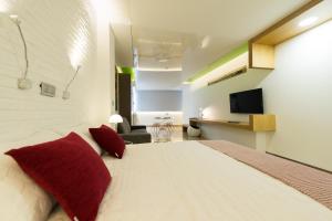 Posteľ alebo postele v izbe v ubytovaní Suites Garden Loft Kandinsky