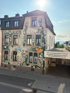 a building with a painting on the side of it at Apartmenthaus Eurenerstrasse 179 in Trier