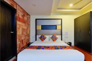 Postel nebo postele na pokoji v ubytování FabHotel Tip Top