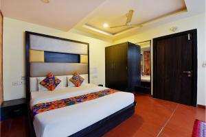 Postel nebo postele na pokoji v ubytování FabHotel Tip Top