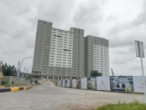 a large tall building with a lot ofagonistsagonists at Antareja LoftVilles By Reccoma in Dukuh