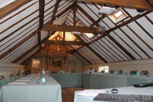 a large room with a long table in a building at The Hare and Hounds in Fulbeck