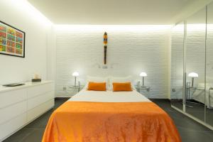 Ein Bett oder Betten in einem Zimmer der Unterkunft Suites Garden Loft Miro