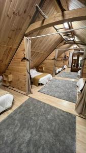 a room with four beds in a attic at L'abri de rioumaou in Saligos