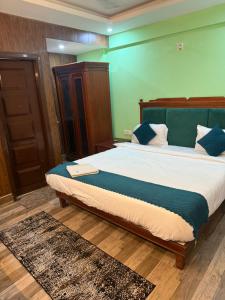 Postel nebo postele na pokoji v ubytování Hotel Kanel Star