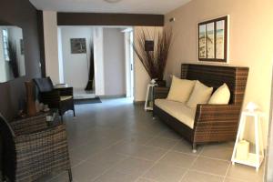 a living room with a couch and chairs at Diavlos Studios in Agiokampos
