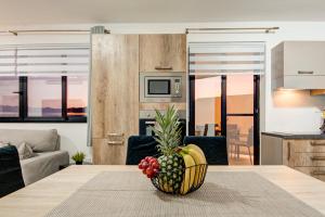 a bowl of fruit on a table in a living room at D Top View in St. Paul's Bay +58 photos