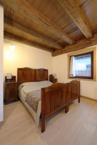 Postel nebo postele na pokoji v ubytování Zoncolan Apartments
