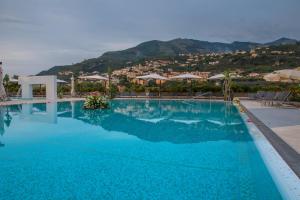 a swimming pool with a view of a mountain at Grand Hotel Moon Valley in Vico Equense