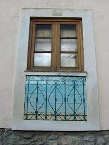 a window on the side of a building at RC - Alcobaça Villa in Alcobaça