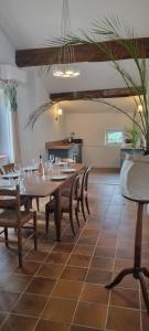a dining room with a table and chairs at Maison Barbaira 