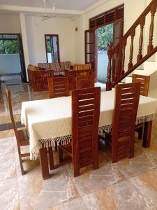 a dining room with a table and chairs at Cinnamon Villa Ambalangoda in Ambalangoda +18 photos