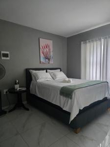 Ένα ή περισσότερα κρεβάτια σε δωμάτιο στο Ella Guest House