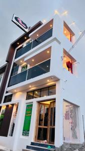 a large white building with stairs in front of it at The Chalet - Cozy Villa with Mini Pool, near Eden Blue Flag Beach, Pondicherry - JR Groups in Puducherry