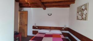 Llit o llits en una habitació de La Tieda - locazione turistica Reolon