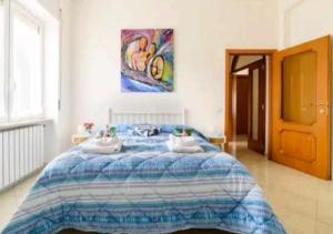 a bedroom with a bed with two pillows on it at Il Soffione Home in Salerno