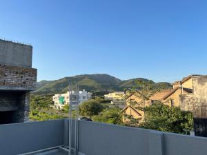 a view of a city from a balcony at Luxury Holiday Home Margala Hills Views Islamabad in Islamabad