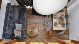 an overhead view of a room with wooden floors and furniture at Nasza Osada in Firlej +83 photos