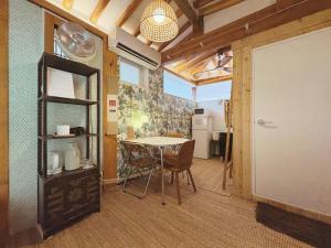 a room with a table and chairs and a door at 'Hanok Hanok' Boutique stay Hotel Seoul - 2min from Gyeongbokgung Palace station in Seoul