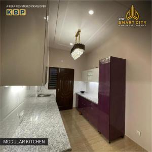 a kitchen with a purple counter and a ceiling at Kbp Smart City in Kharar