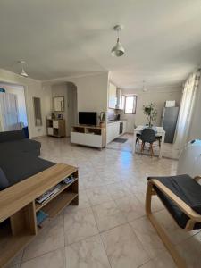 a living room with a couch and a table at Appartamento Cavour in Ventimiglia