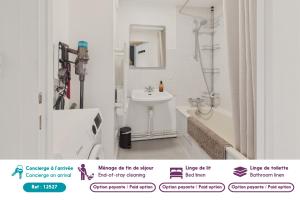 a white bathroom with a sink and a shower at Appartement avec piscine commune pour 4 in Guérande +10 photos