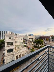 a view of a city from a balcony at Serene Getaway with Prime Emperador View in Mandurriao