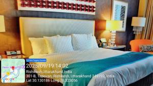 a hotel room with a large bed with avertisement at Hotel Kavya in Rishīkesh