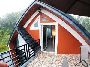 a small house with a large glass door at Krabi Top Sea Hill Villa in Klong Muang Beach