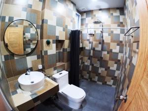a bathroom with a toilet and a sink and a mirror at Krabi Top Sea Hill Villa in Klong Muang Beach +54 photos