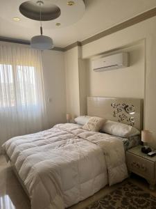 Cama ou camas em um quarto em Five mins to Arkan&Zed