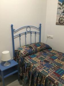 Ένα ή περισσότερα κρεβάτια σε δωμάτιο στο Acino Apartamento