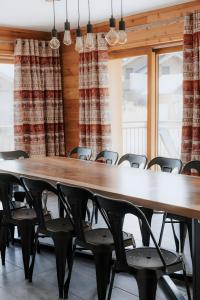 a conference room with a large table and chairs at Chalet Salt Lake in La Toussuire