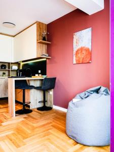 an office with a desk and a chair in a room at Blush Studio at Rose in Prishtinë
