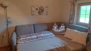 Un pat sau paturi într-o cameră la THENN