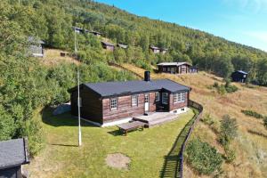 an aerial view of a cabin on a hill at Fjellro-Geilo Cabin Retreat in Geilo