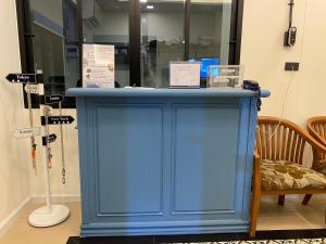 a blue cabinet with signs on top of it at Airport one station hometel - Suvarnabhumi - SHA Extra Plus in Bangkok