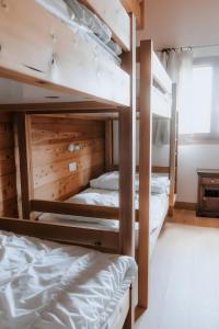 a bedroom with two bunk beds in a room at Chalet Salt Lake in La Toussuire +28 photos
