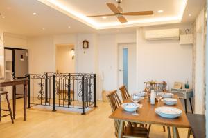 a dining room with a table and a ceiling fan at Haiyan Design House - Feel like a vacation at city in Seoul +77 photos