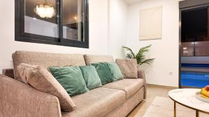 a living room with a couch and a table at Villa Estrella del Mar in San Pedro del Pinatar +101 photos