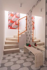 a rendering of a staircase in a building with colourful art at Trzypoziomowy apartament KALIFORNIA - z klimatyzacją i parkingiem w centrum miasta in Nowy Targ