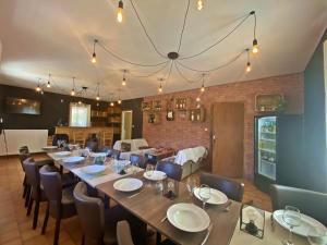 a dining room with a long table and chairs at CASA-2040 Family-Friendly Chalet Saint-Véran in Saint-Véran