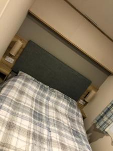 En eller flere senge i et værelse på Rejuven8 Rentals - Kingfisher - ingoldmells