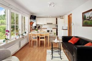 a living room with a couch and a table at SKA676-Immeln-Breanaes-3004 in Breanäs