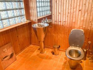 a bathroom with a toilet and a sink at SKA712-Hoerby-Osby-Strandvaegen-120 in Osbyholm