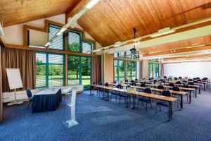 a large room with tables and chairs in it at Best Western Parkhotel Brehna-Halle in Brehna