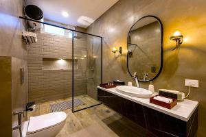 a bathroom with a sink and a mirror at Samprati 3BR Villa with Balconies, Homecook & Pet Stay in Kasauli