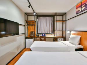 Postel nebo postele na pokoji v ubytování ibis Copacabana Posto 2 + 97 fotografií