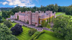 an aerial view of an old castle with trees at The Tay Residence, City Centre in Perth